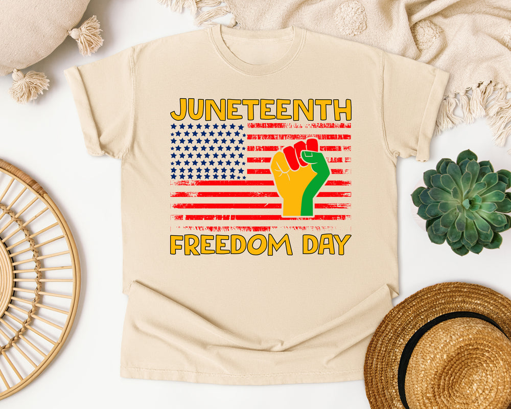 Juneteenth Freedom Day Flag Fist graphic tee in Ivory Comfort Colors 1717