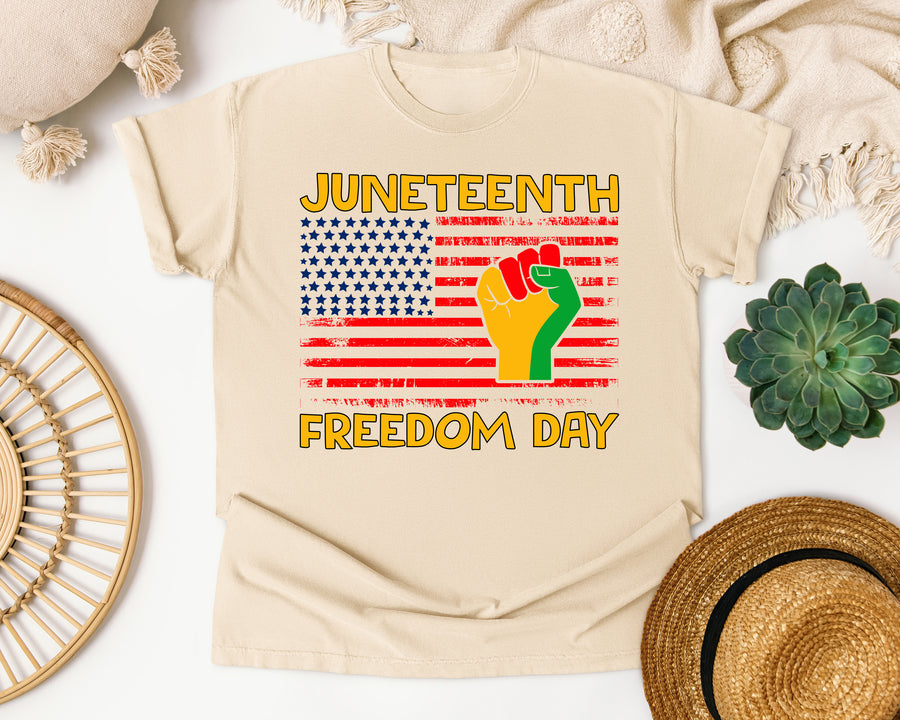 Juneteenth Freedom Day Flag Fist graphic tee in Ivory Comfort Colors 1717