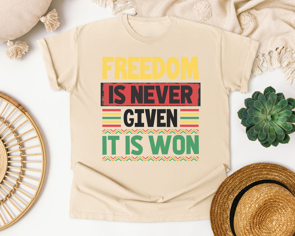 Freedom Is Never Given graphic tee in Ivory Comfort Colors 1717