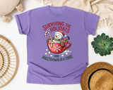Surviving the Holidays One Meltdown at a Time graphic tee in Violet Comfort Colors 1717