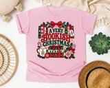 A Very Bookish Christmas graphic tee in Blossom Comfort Colors 1717
