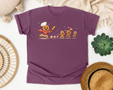 Gingerbread Chef Chasing Cookies graphic tee in Berry Comfort Colors 1717