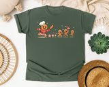 Gingerbread Chef Chasing Cookies graphic tee in Moss Comfort Colors 1717