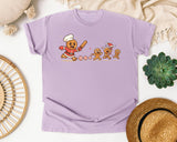 Gingerbread Chef Chasing Cookies graphic tee in Orchid Comfort Colors 1717