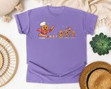 Gingerbread Chef Chasing Cookies graphic tee in Violet Comfort Colors 1717