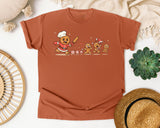 Gingerbread Chef Chasing Cookies graphic tee in Yam Comfort Colors 1717