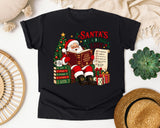 Santa's Reading List graphic tee in Black Comfort Colors 1717